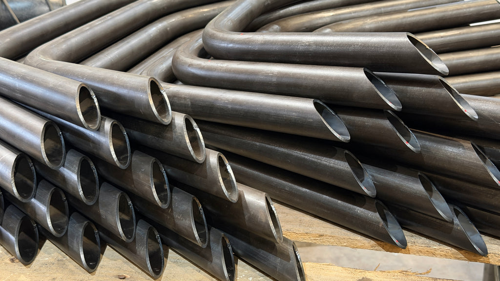 Bent steel tubes with angled CNC plasma cut ends