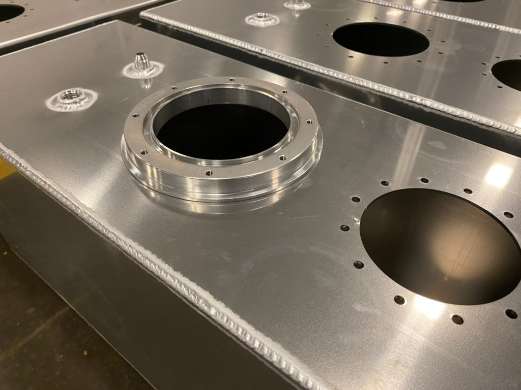 Close view of an aluminum tank with TIG welded seams and fittings
